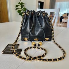 Vintage Chanel Mini Triple Cc Bucket Bag In Gorgeous Black Caviar Leather Ultra Rare Item In Very Good Condition With Some Minimal Signs Of Wear Consistent With Age. Some Tarnishing To Hardware But Overall Good Shiny Condition. Leather Is In Very Good Condition With Some Minimal Signs Of Wear, No Odors, Scratches, Holes, Or Pilling. Clean Interior. Comes With Its Insert, Auth Card, Booklet, And Serial Sticker (Illegible). 100% Authentic Luxury Everyday Shoulder Bucket Bag, Luxury Travel Bags With Chain Strap, Elegant Black Bucket Bag For Evening, Evening Bucket Bags With Branded Hardware, Designer Bag With Chain Strap, Luxury Pouch Bags As Fashion Accessory, Designer Gold Bucket Bag For Travel, Luxury Everyday Rectangular Bucket Bag, Luxury Rectangular Bucket Bag For Everyday