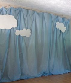 there is a curtain with clouds on it