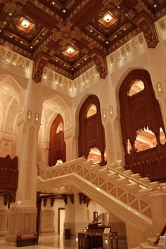 the inside of a large building with many windows and wooden steps leading up to it