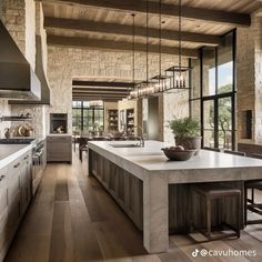 a large kitchen with an island counter top and wooden flooring in front of windows