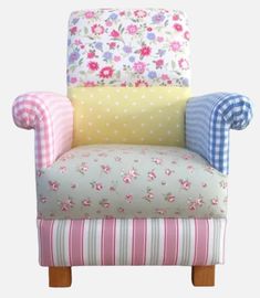 an upholstered chair with four different fabrics on the back and sides, all in various colors