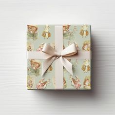 a gift box with a bow on top of it