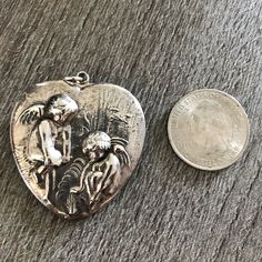 Vintage Sterling Silver Repousse Heart Pendant. Featuring Adorable Cherub Figures. This Pendant Is Large As Shown Next To A Quarter. I Bought This In Carmel Over 30 Years Ago And It Was Old Even Then. I Wish I Knew More About It But It’s Definitely A Special Piece. I Wish I Knew, Jewelry Sterling Silver, Vintage Sterling Silver, 30 Years, Heart Pendant, Womens Jewelry Necklace, Jewelry Necklaces, Jewelry Making, Women Jewelry