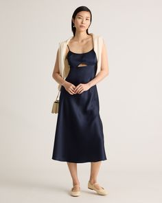 A playful twist on a classic silk dress, meet our 100% Washable Silk Cutout Midi Slip Dress. This super flattering fit is made from 100% mulberry silk, in a satin finish. The kicker? Our silk is washable. Easy to style, easy to wash for low-maintenance luxe. Plus, silk fiber contains 18 kinds of amino acids that make it amazing for skin nourishment, hypo-allergenic, and naturally thermoregulating to help maintain body temperature.  | Quince | Women's Cutout Midi Slip Dress in Navy, Size Medium, Chic Silk Midi Dress With Satin Finish, Fitted Silk Satin Dress For Brunch, Elegant Silk Satin Dress For Brunch, Silk Satin Midi Dress For Brunch, Fitted Silk Dress For Brunch, Silk Midi Dress With Satin Finish, Elegant Rayon Dresses With Bias Cut, Silk Midi Slip Dress For Brunch, Elegant Fitted Rayon Slip Dress