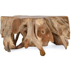 a piece of wood that is shaped like an elephant's trunk and has been carved into a table