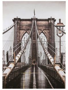 an old photo of the brooklyn bridge in the rain