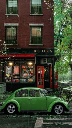 a green car parked in front of a bookshop on a rainy day with trees