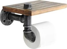 the toilet paper holder is made from metal pipes and wood