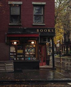 an image of a book store on the street in the rain with text that reads, books visit sponsored