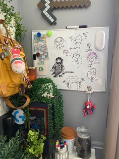 a room with various plants and pictures on the wall, including a purse hanging from a hook