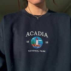 *SIZES ARE UNISEX* -I'd suggest your usual size for a more fitted look, or sizing up for a more relaxed fit.*these sweatshirts are extra comfy when oversized 🦞 "Acadia National Park" embroidered on a cute vintage-style crewneck. A sweatshirt bound to keep you warm in the colder months. A pre-shrunk, classic fit sweater that's made with air-jet spun yarn for a soft feel and reduced pilling. Your new favorite sweatshirt! * 50% cotton, 50% polyester * Pre-shrunk * Classic fit with no center crease National Parks Sweatshirt, Maine Sweatshirt, Alaska Sweatshirt, New Hampshire Hoodie, North Shore Hawaii Hoodie, Fitted Sweater, Look Plus, Style Vintage, Maine