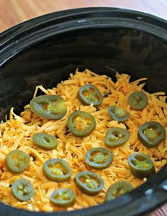 green peppers and shredded cheese in a slow cooker