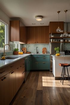 a kitchen filled with lots of counter top space and wooden flooring next to a window