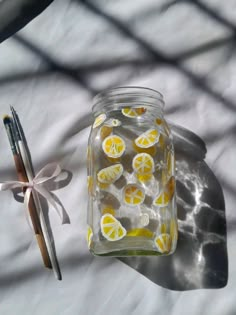 a jar filled with lemons sitting on top of a table