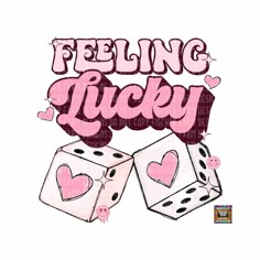 a pair of dices with the words feeling lucky in pink and black on them