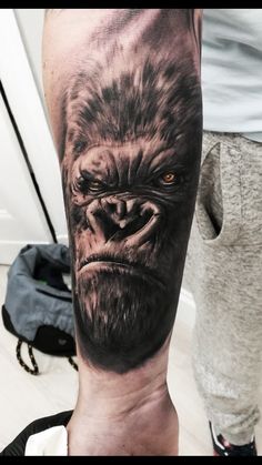 a man's arm with an angry gorilla tattoo on it