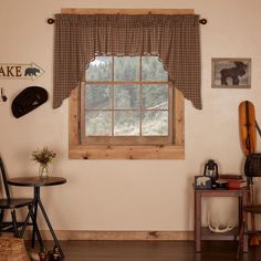 a living room filled with furniture and a window