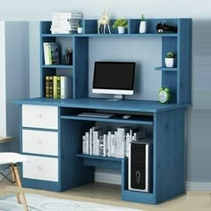 a desk with a computer on it and bookshelf above the desk, along with other office supplies