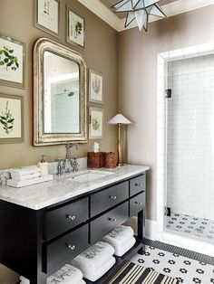 a bathroom with a sink, mirror and bathtub