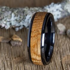 black wedding ring with whiskey barrel wood Whiskey Wedding Ring, Whiskey Barrel Rings Wedding Bands, Bourbon Barrel Ring, Whiskey Barrel Rings, Whisky Barrel Metal Rings, Whiskey Barrel Ring, Men’s Wedding Band Whiskey Barrel