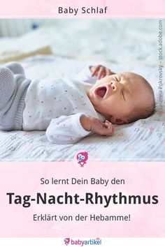 a baby laying on top of a bed with the words tag nach - rhythmus