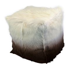 a white and brown sheepskin hat on a white background