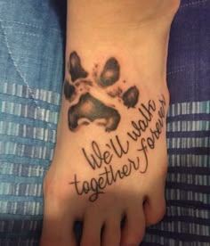 a person with a tattoo on their foot that says, we'll walk together