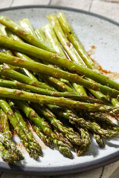 asparagus spears on a plate ready to be cooked in the oven for dinner