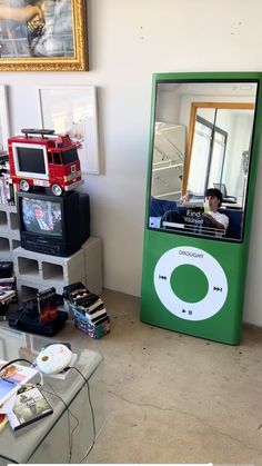 an ipod sitting on top of a table in front of a mirror