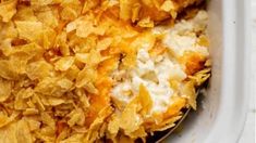 a casserole dish filled with potato chips and cheese