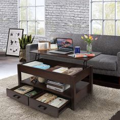 a living room with a couch, coffee table and bookshelf on the floor