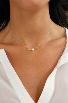 A simple, classic single 6mm crystalline pearl graces a dainty, diamond cut minimalistic chain.  Perfect for anyone and everyday! Closure: spring ring Materials: 14K Gold Filled or Sterling Silver Measures 15" + a 2" extender or 18" + a 2" extender Model is wearing 15" length hooked on shortest loop Handmade in New Yor Christine Elizabeth, Affordable Fine Jewelry, Simple Pearl Necklace, Dainty Pearl Necklace, Dainty Pendant Necklace, Elizabeth Jewelry, Single Pearl Necklace, Gemstone Hoop Earrings, Pendant Necklace Simple