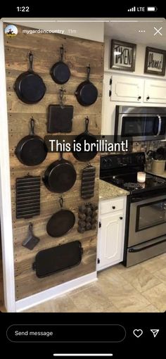 a kitchen with pots and pans mounted to the wall