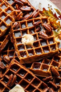 waffles with syrup and pecans on a plate