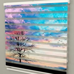 an image of a window with blinds in the shape of trees and birds flying through the sky