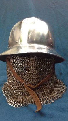 a metal helmet with chains on it