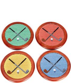 four different colored buttons with crossed sticks on them