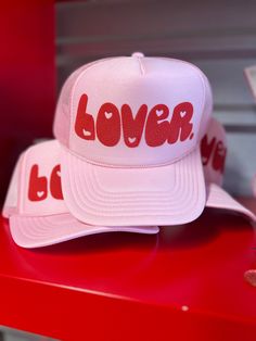 Declare your love in style with our Lover Puff Vinyl Trucker Hat. This playful and eye-catching hat, featuring a unique lover puff design, will add a touch of fun to any outfit. Pink Trucker Hat LOVER in Red Puff across front Heart Detail adjustable back Puff Vinyl, Puff Design, Pink Trucker Hat, Outfit Pink, In Style, Trucker Hat, Vinyl, Hats, Red