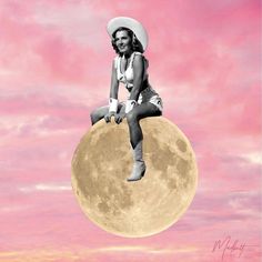 a woman sitting on top of a giant moon