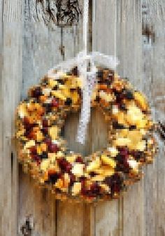 a wreath hanging on the side of a wooden door