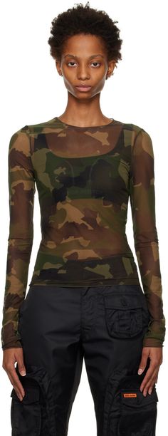 Sheer stretch polyester mesh T-shirt. Graphic pattern printed throughout. · Crewneck · Logo patch and central seam at back Supplier color: Camo green Camo Long Sleeve, Military Design, Mesh T Shirt, Heron Preston, Green Camo, Graphic Patterns, Preston, Patch Logo, Long Sleeve T Shirt