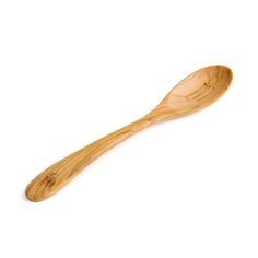 a wooden spoon sitting on top of a white surface