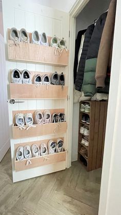 there are many shoes on the shelves in this closet