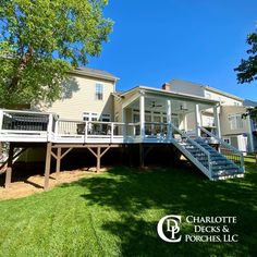 the back side of a house with stairs leading up to it's second story