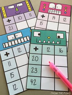 two color - by - number printable calendars with a pink pen