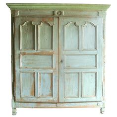 an old wooden armoire with two doors