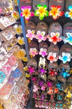 there are many colorful flowers on display in the store