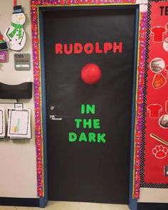 a classroom door decorated with the words rudolph in the dark and an image of a red ball