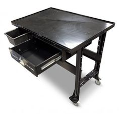 a black table with two drawers on it and one drawer open to show the contents