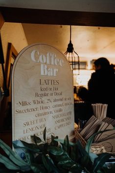 a coffee bar sign sitting on top of a counter